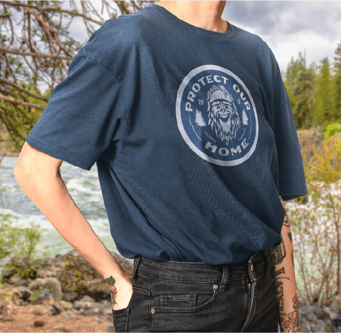 Person in 'Protect Our Home' shirt