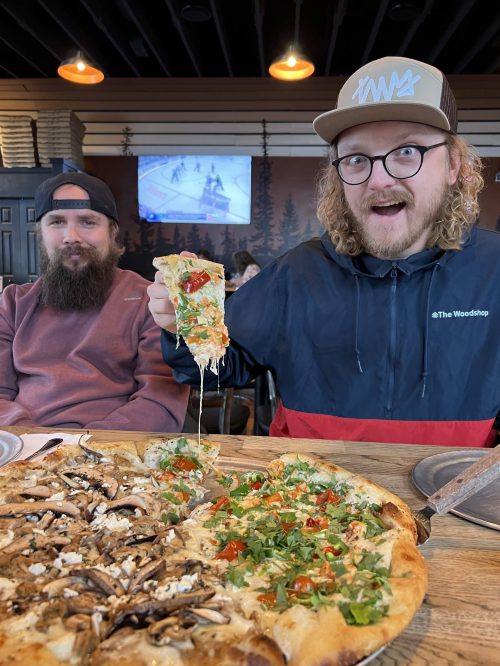 Tony and Jeremy eating pizza at Zeeks